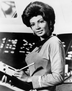 An example of the tight fitting clothing and excessive hair and make-up worn by females in the show.