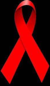 The AIDS awareness ribbon, which is a folded red ribbon. It sits on a white background.