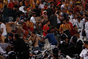 Police enter a crowd of Egyptian hooligans after they have acted disorderly