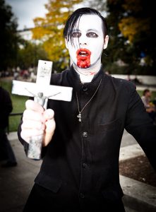 Goth holding cross at World Zombie Day, 2011