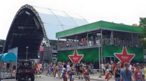 Green Heineken beer pavilion next to a stage at Ultra Music Festival