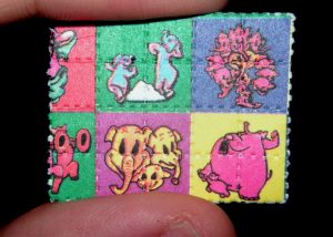 Photo of a colorful tab of acid (LSD).