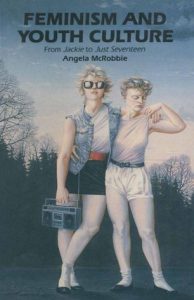 Illustration of two young women standing outside, leaning on each other. One, wearing sunglasses, holds a boombox in one hand. 